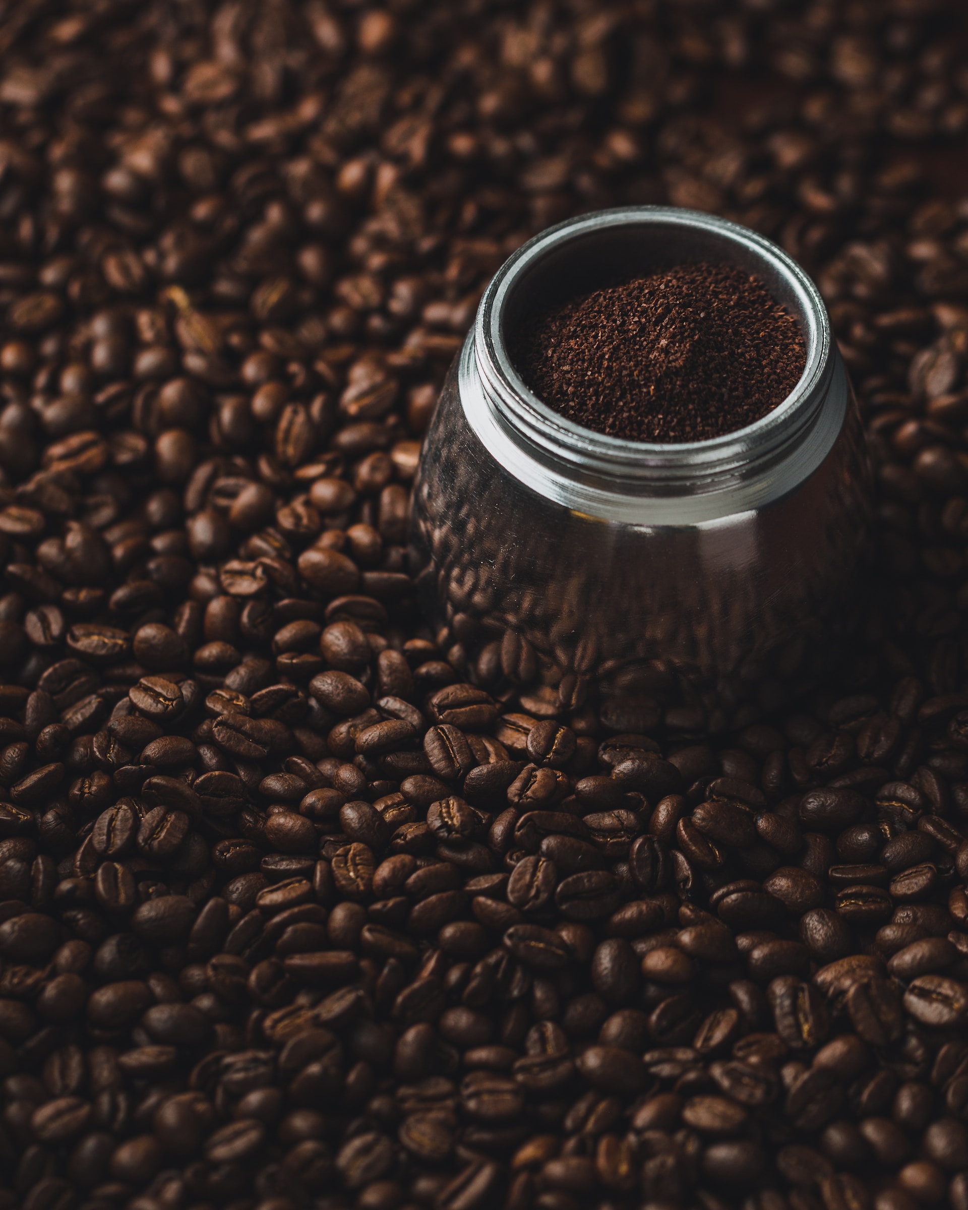 Fresh coffee grounds in jar